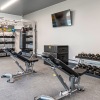 Large fitness center with ample amount of equipment.
